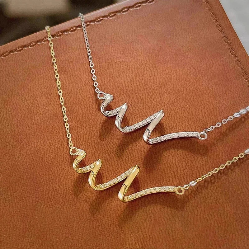 Huitan Ästhetische wellenförmige Anhänger-Halskette für Frauen, Hochzeit, Verlobung, Modeaccessoires, eingelegter glänzender CZ, vielseitiger Schmuck