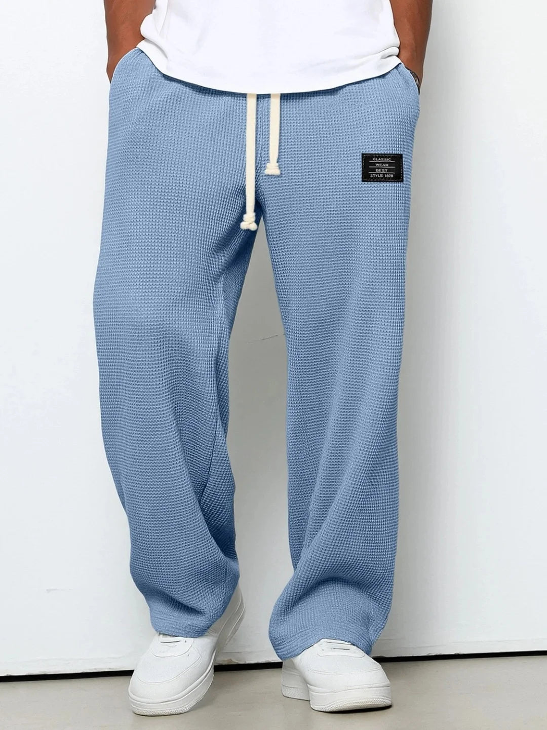 Herren Frühling-Herbst Trendige Marken-Jogginghose mit Lockerem Schnitt und Dehnbarem Geradem Bein Waffelstoff. Micro-Bouncy Sportliche Freizeithose