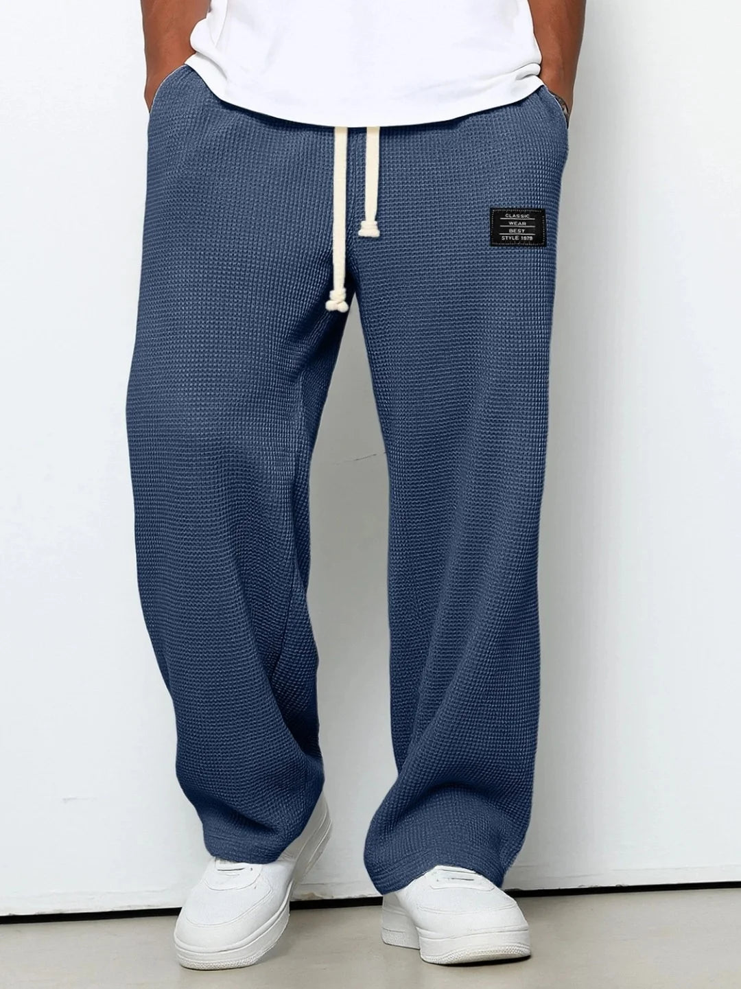 Herren Frühling-Herbst Trendige Marken-Jogginghose mit Lockerem Schnitt und Dehnbarem Geradem Bein Waffelstoff. Micro-Bouncy Sportliche Freizeithose