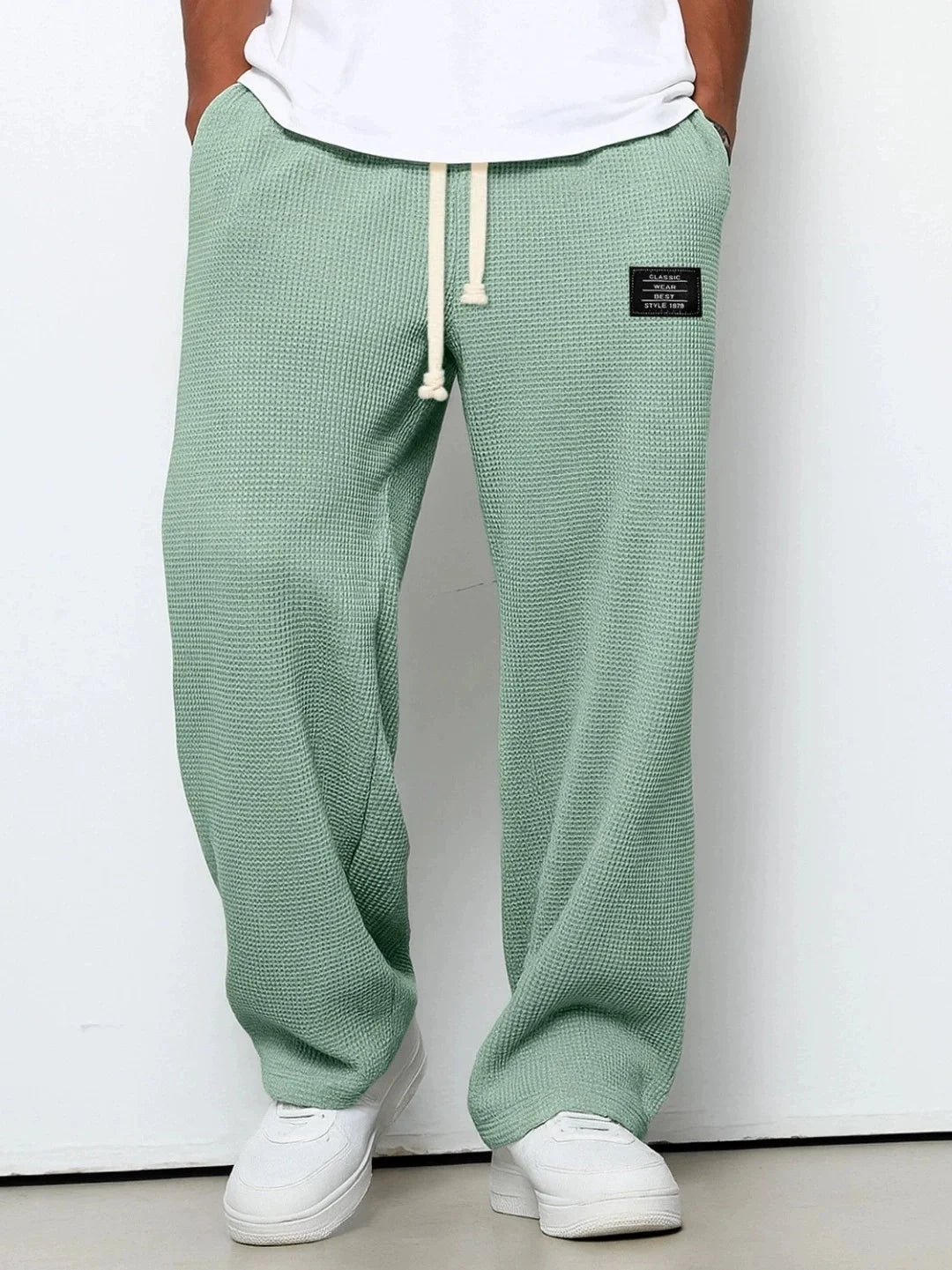 Herren Frühling-Herbst Trendige Marken-Jogginghose mit Lockerem Schnitt und Dehnbarem Geradem Bein Waffelstoff. Micro-Bouncy Sportliche Freizeithose