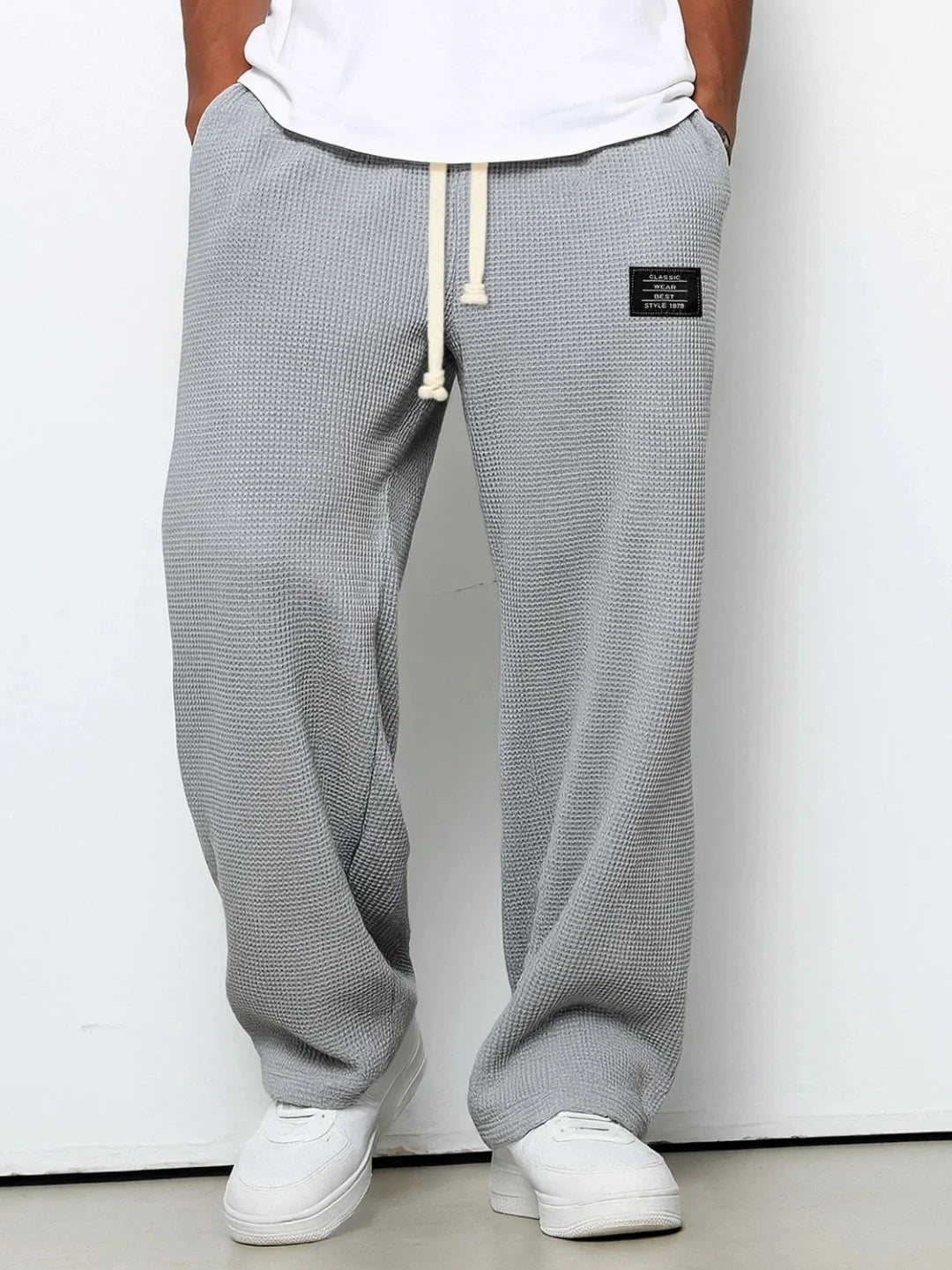 Herren Frühling-Herbst Trendige Marken-Jogginghose mit Lockerem Schnitt und Dehnbarem Geradem Bein Waffelstoff. Micro-Bouncy Sportliche Freizeithose