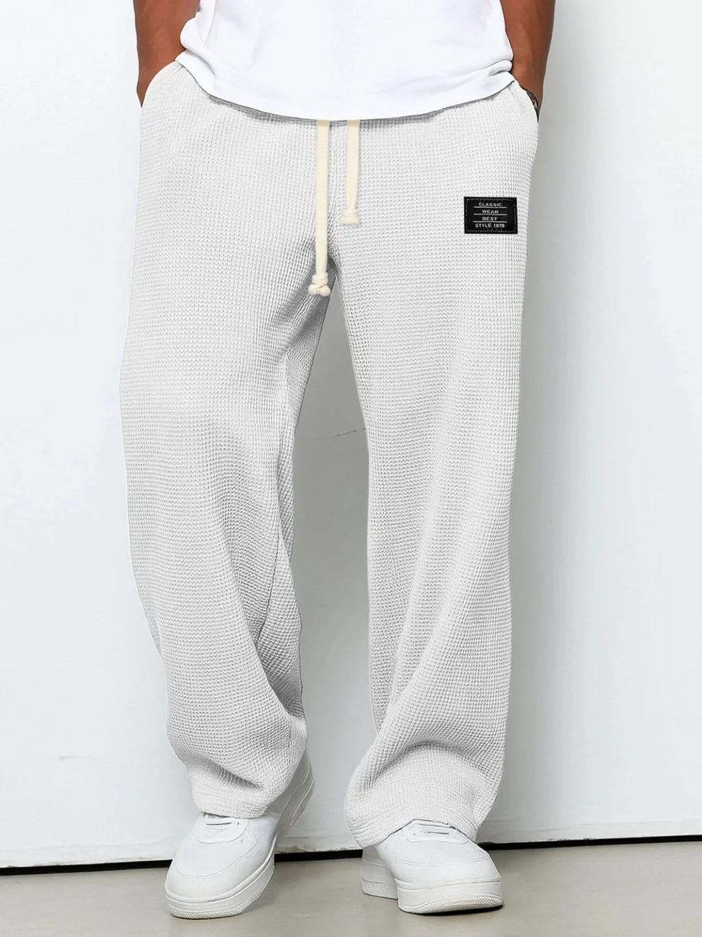 Herren Frühling-Herbst Trendige Marken-Jogginghose mit Lockerem Schnitt und Dehnbarem Geradem Bein Waffelstoff. Micro-Bouncy Sportliche Freizeithose