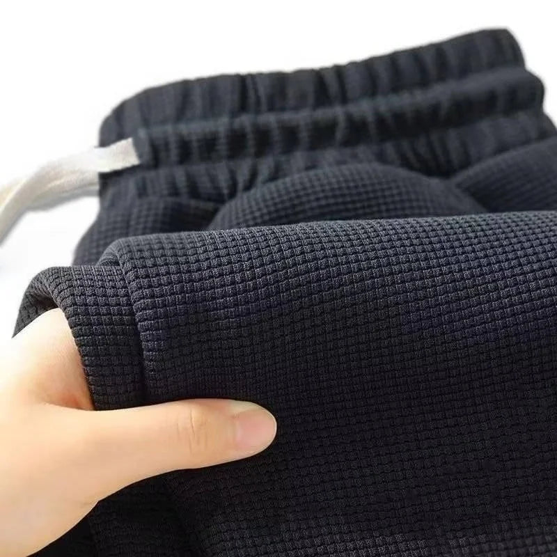 Herren Frühling-Herbst Trendige Marken-Jogginghose mit Lockerem Schnitt und Dehnbarem Geradem Bein Waffelstoff. Micro-Bouncy Sportliche Freizeithose