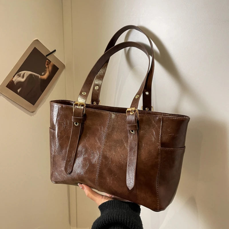 2026 Neue Koreanische Retro PU-Leder Ketten-Schultertaschen Damen Mode Schwarze Große Kapazität Tragetasche Hochwertige Damenhandtaschen