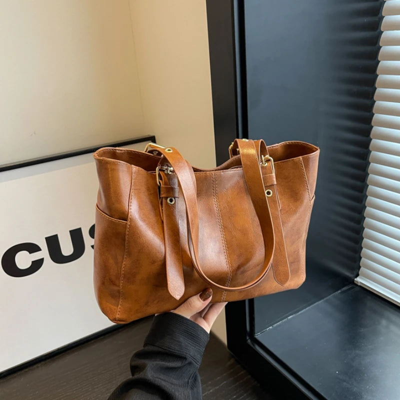 2026 Neue Koreanische Retro PU-Leder Ketten-Schultertaschen Damen Mode Schwarze Große Kapazität Tragetasche Hochwertige Damenhandtaschen